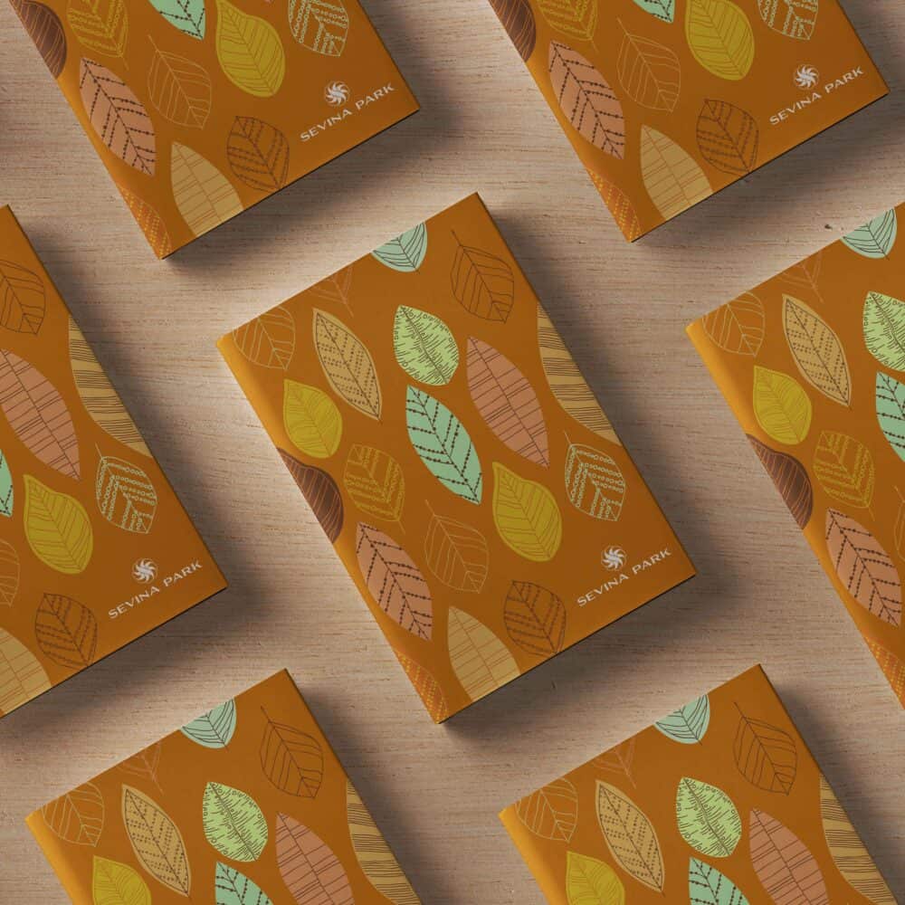 Sevina Park brand identity with leaf-patterned packaging design on an earthy background, showcasing visual identity.