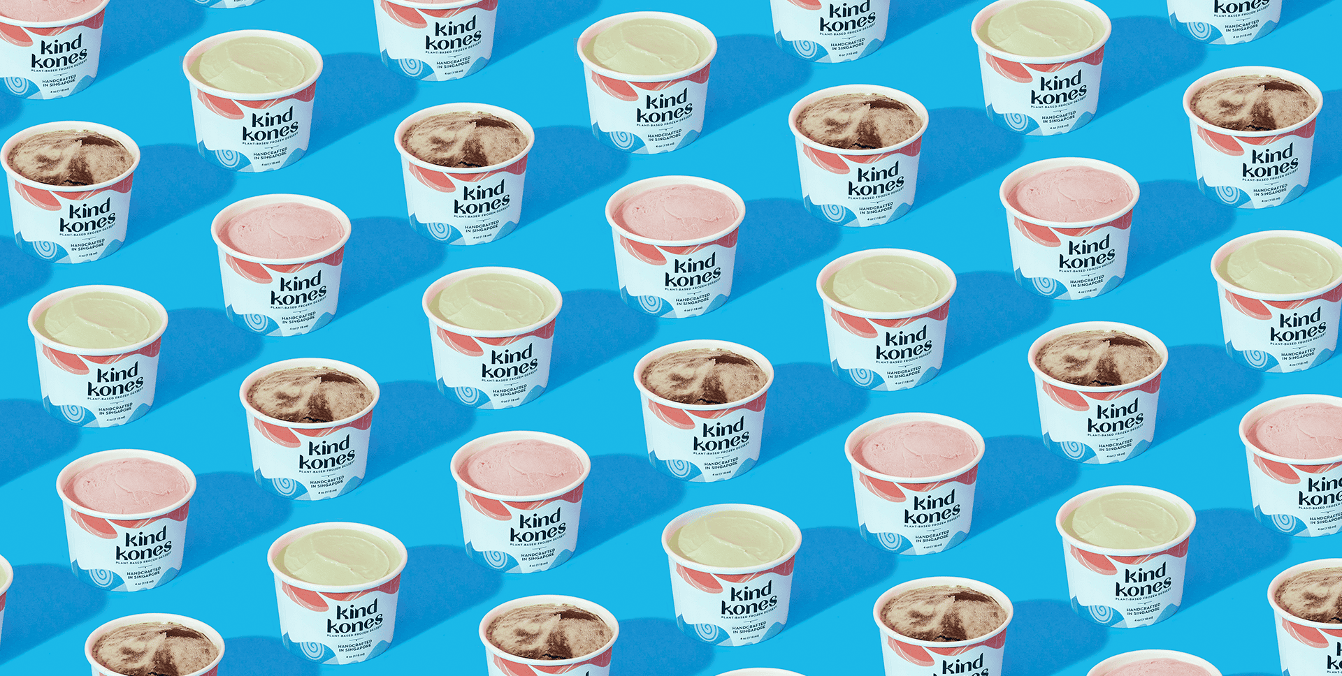 Kind Kones ice cream cups showcasing branding and packaging design on a blue background.
