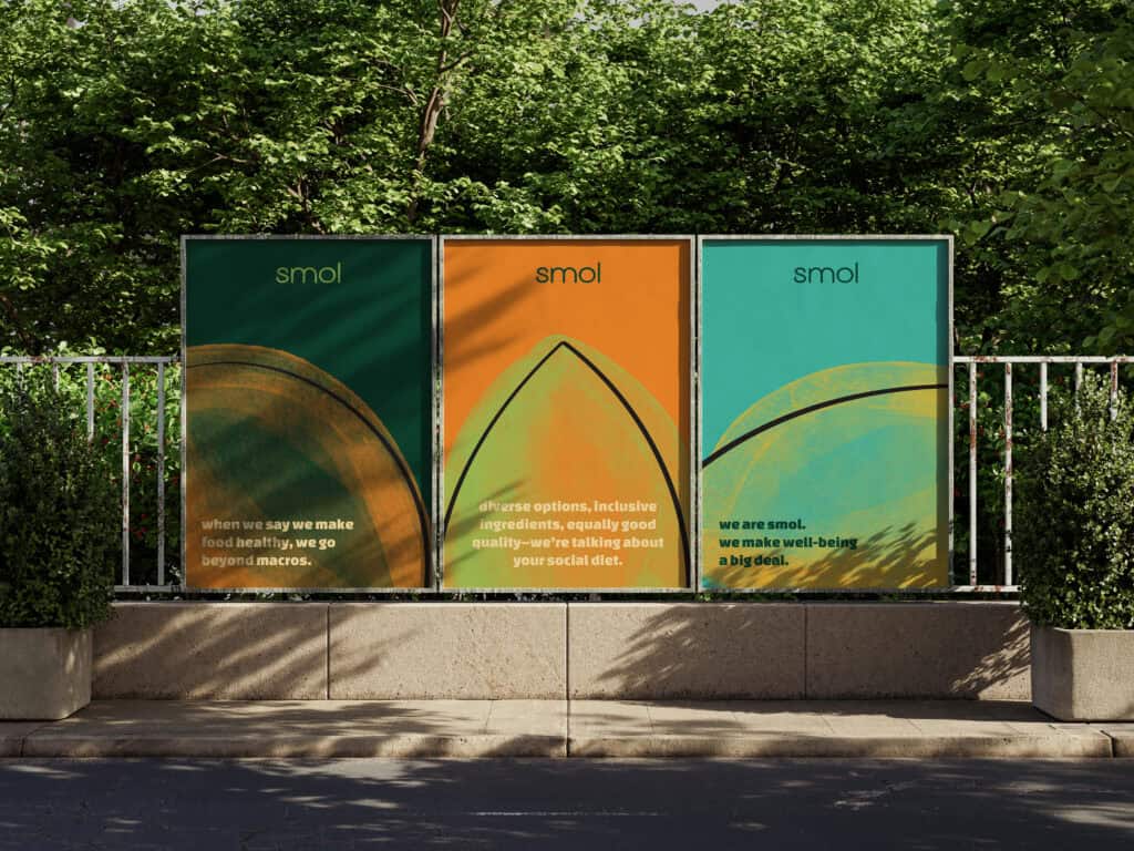 Outdoor signage for smol brand with bold green, orange, teal designs, highlighting brand identity and wellness campaign.