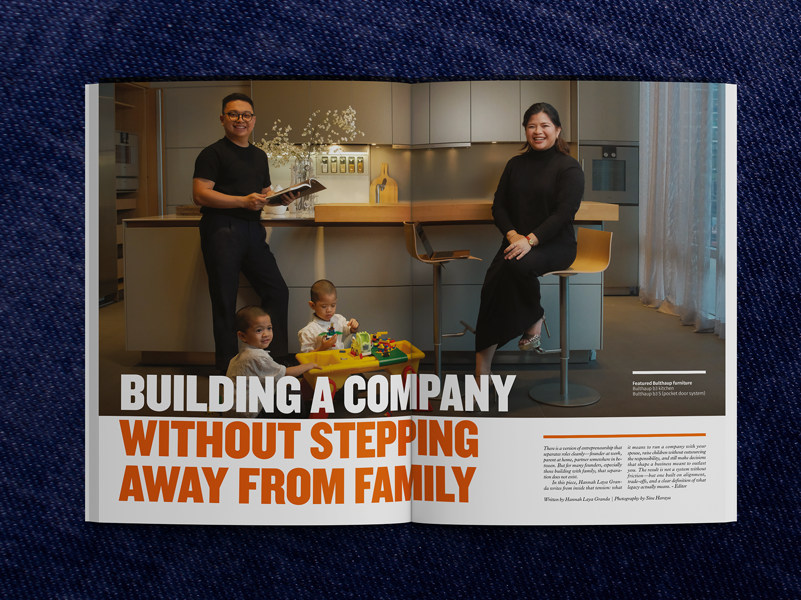 Family business owners with children in modern kitchen, showcasing work-life balance. Text: Building a Company Without Stepping Away From Family.