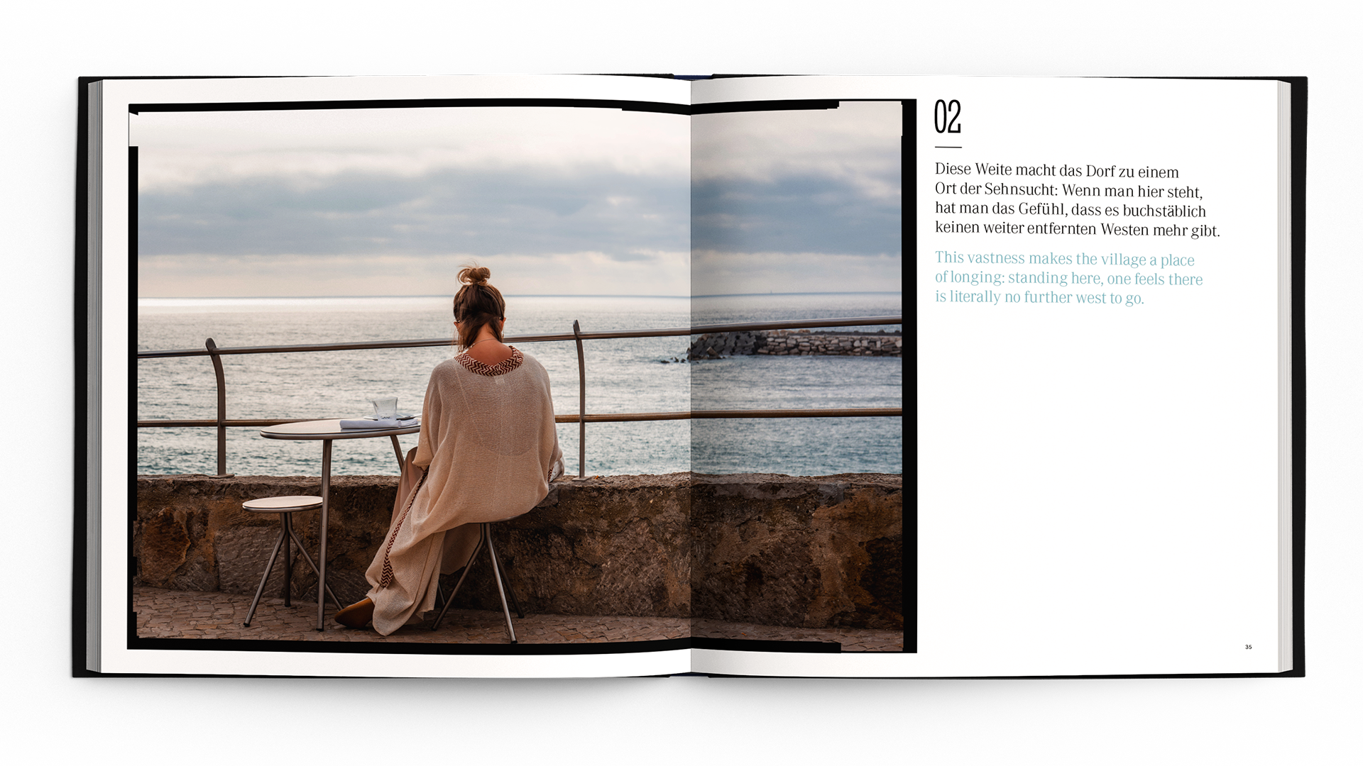 Woman sitting by seaside table, wrapped in a blanket, gazing at the ocean, conveying tranquility and reflection.