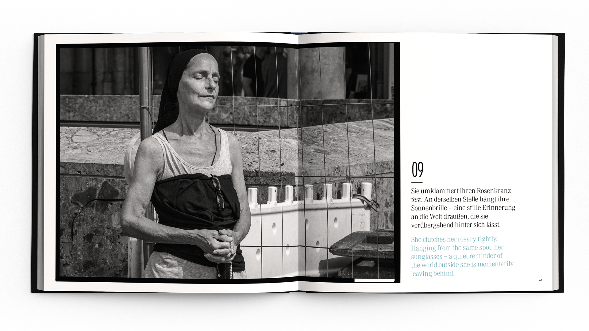 Black-and-white photo of a woman holding a rosary beside a construction site, reflecting contemplative moment.