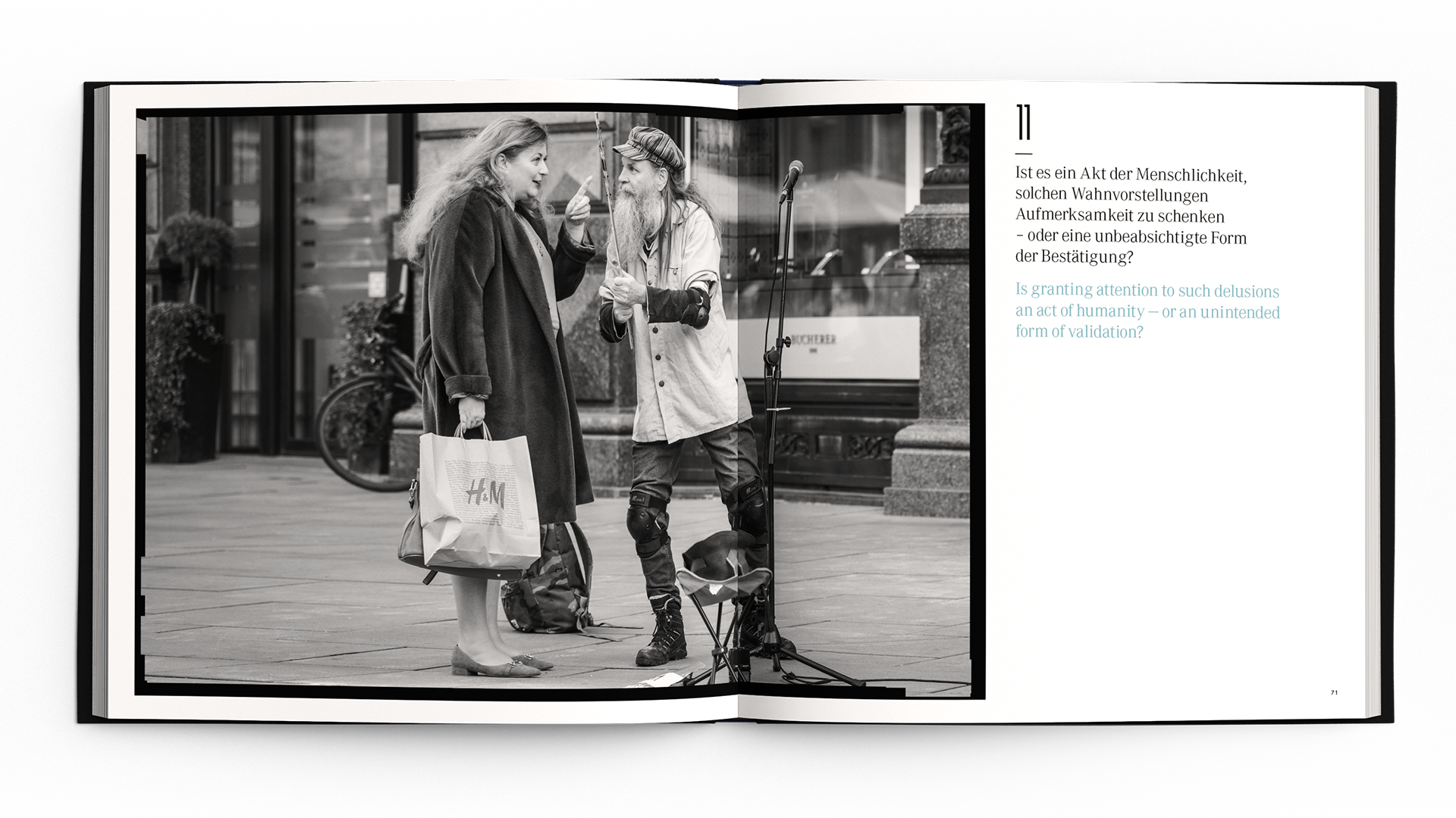 Black and white street scene with two people interacting, standing near a microphone, and holding an H&M shopping bag.