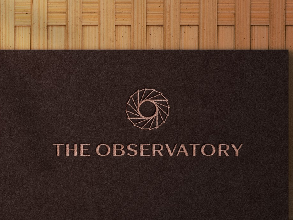 Design For Tomorrow: The Observatory logo on textured stationery, featuring modern visual identity branding elements.