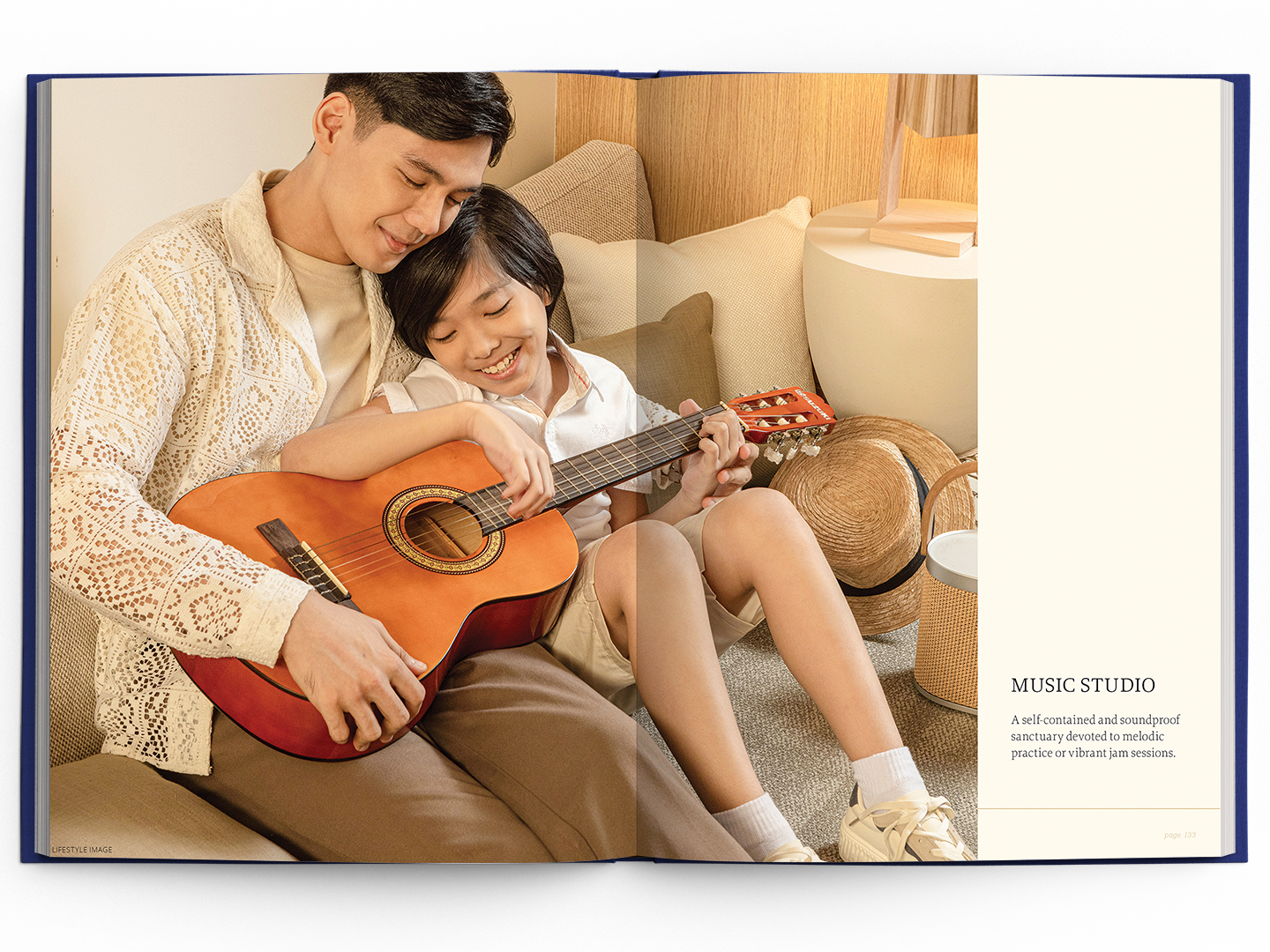 Father and son enjoying guitar playing in a cozy living room, showcasing a lifestyle element for Music Studio branding.