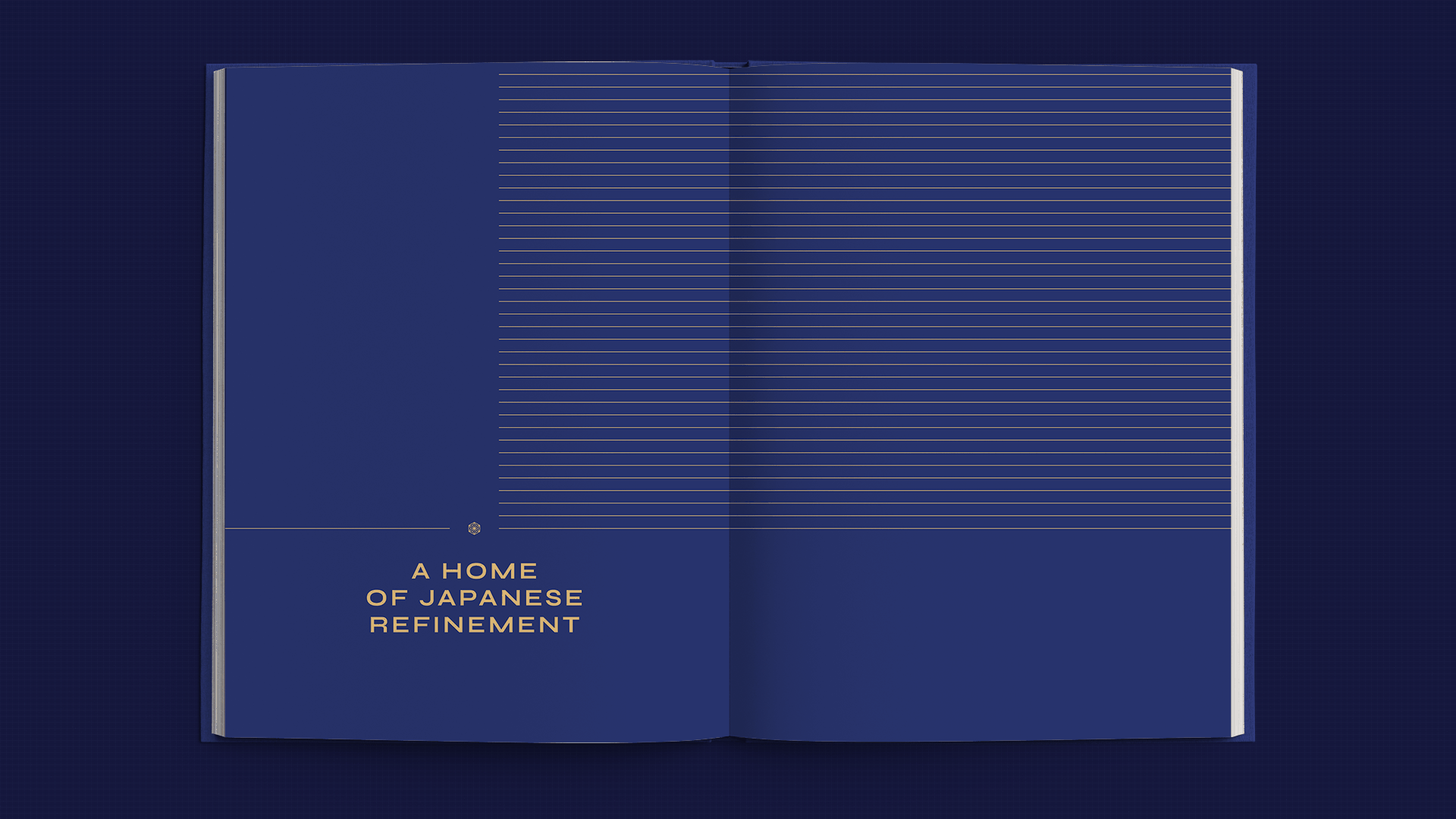 Open book spread with dark blue pages, gold lines, and text A Home of Japanese Refinement, showcasing visual identity.